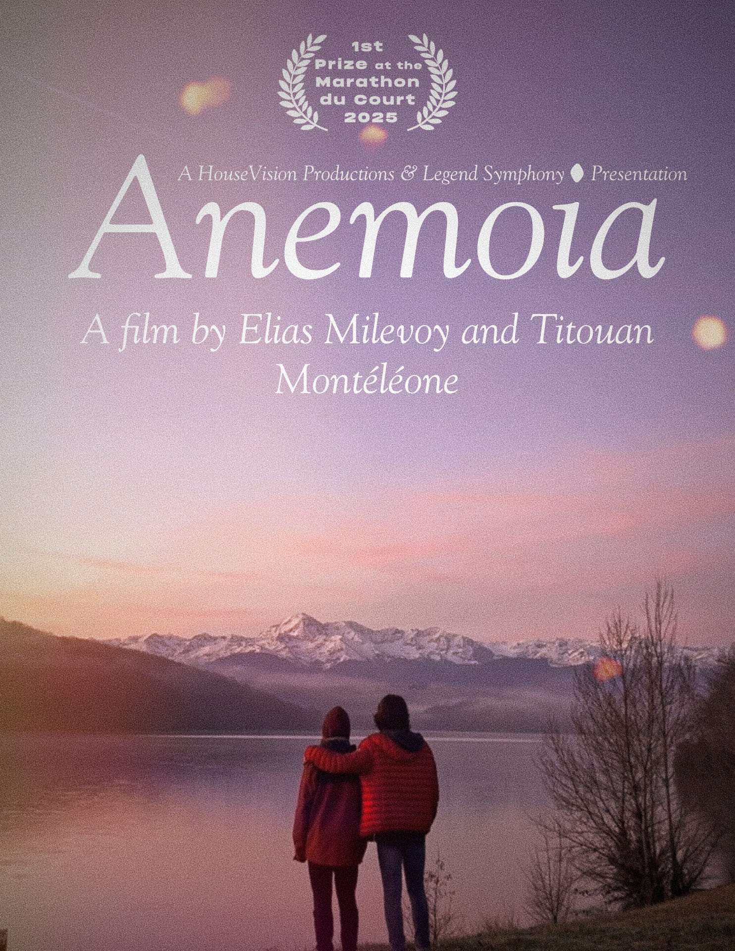 The poster for Anemoia where two men seen from behind look at the lake and mountain range that is in front of them. There’s some text at the top of the poster.